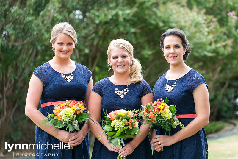 blue and coral bridesmaids with sunflowers