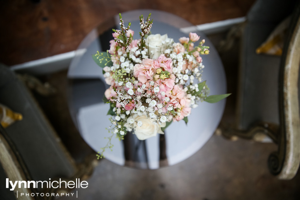 soft pink and white flowers on glass table