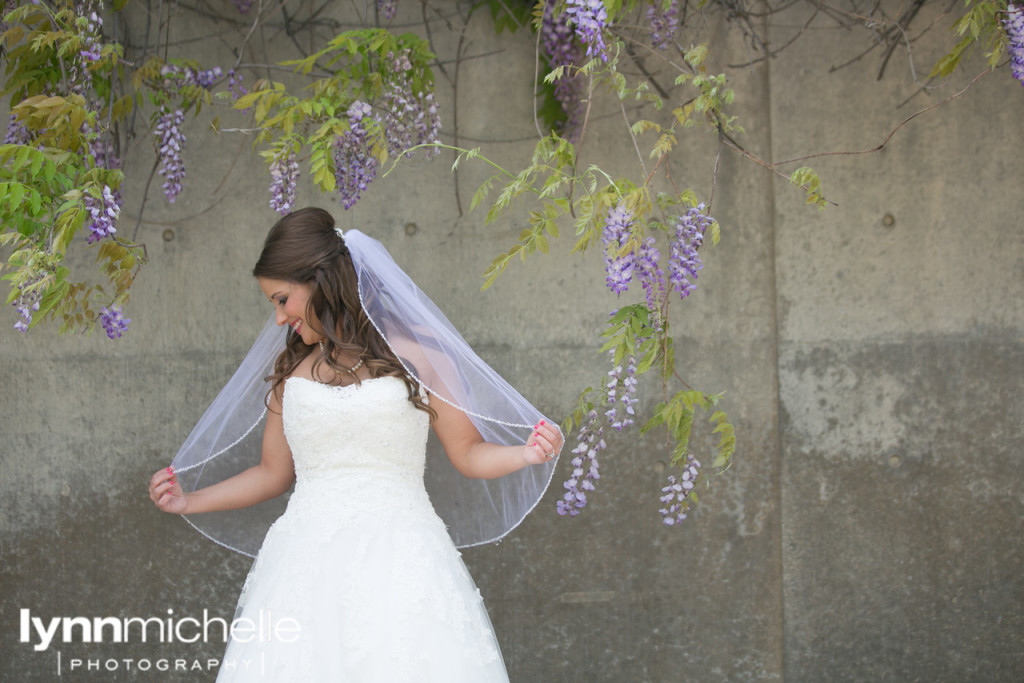 traditional bride with purple wisteria flowers in fort worth