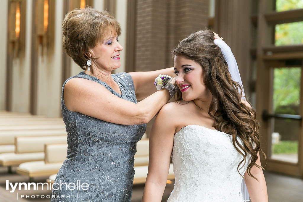 mom helping bride with veil in fort worth