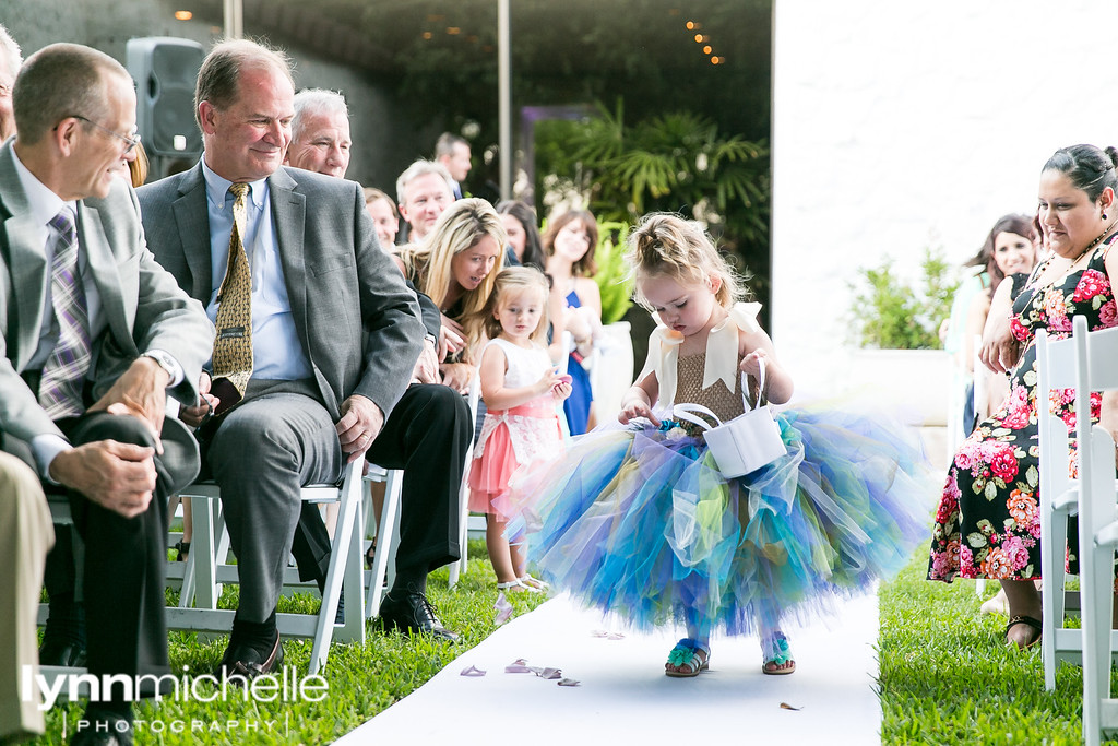 cute flower girl in blue purple and green