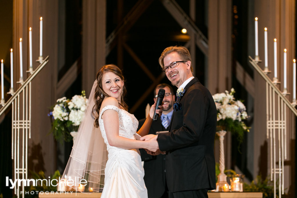 happy bride and groom during ceremony at chapel